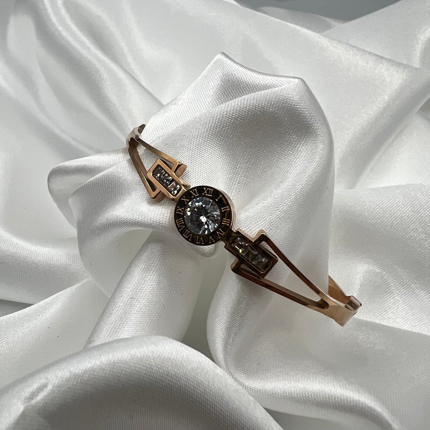 Rose Gold plated stainless steel Roman Numeral Bangle